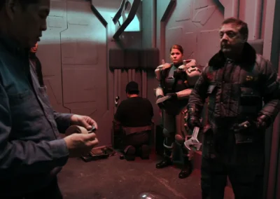 5 people on a spaceship set between takes.